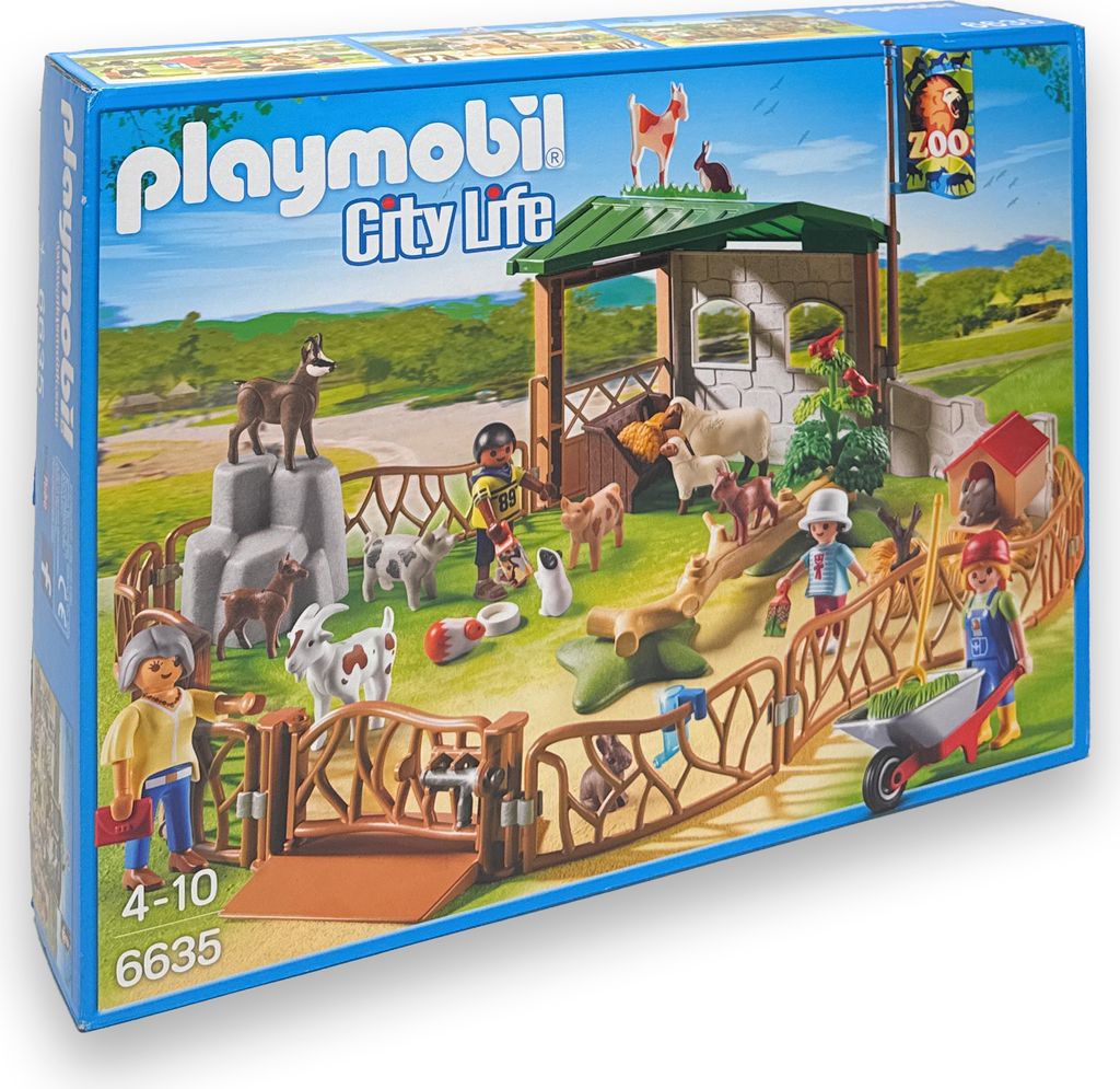 The image shows the packaging of a Playmobil zoo playset, featuring various animals and figures.