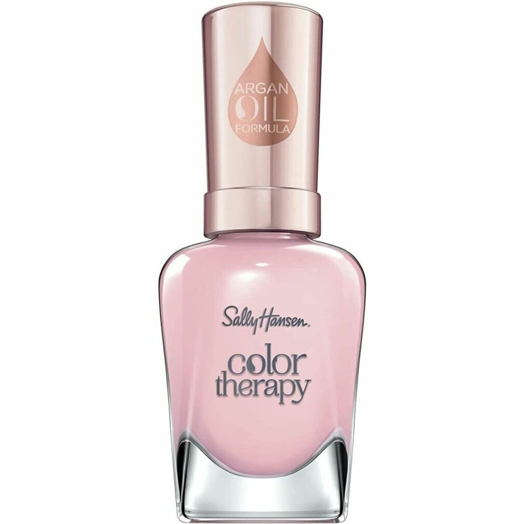 A bottle of Sally Hansen Color Therapy nail polish with an Argan Oil formula.