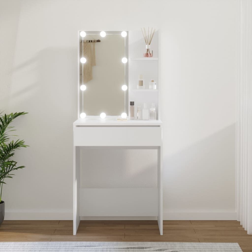 A white vanity table with a lighted mirror and shelves is shown in a room.