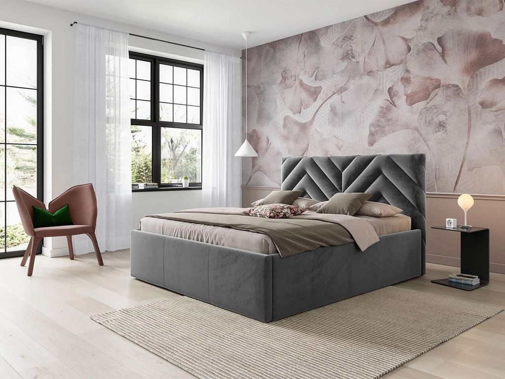 A bedroom scene with a bed, chair, and a window.