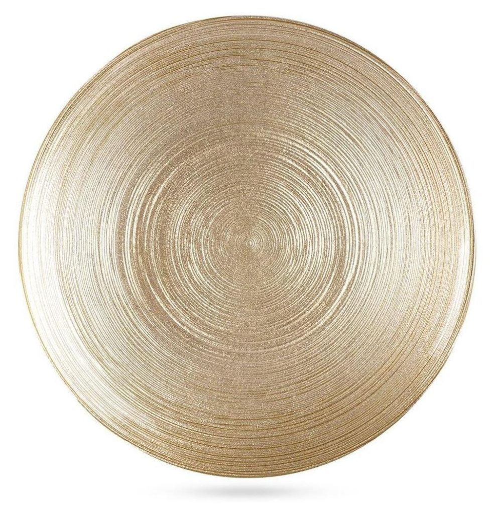 A gold glass dessert plate with a textured, concentric ring pattern.