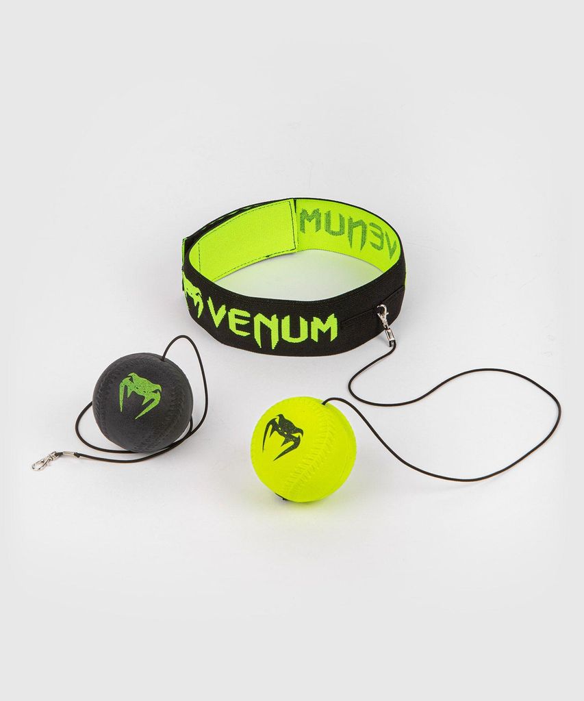 A boxing reflex ball set with a headband and two balls on a white background.