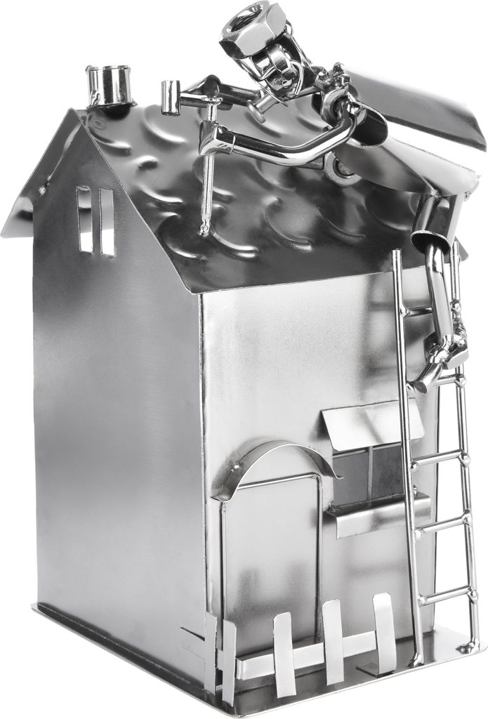 A metal figurine of a house with a roofer working on the roof.