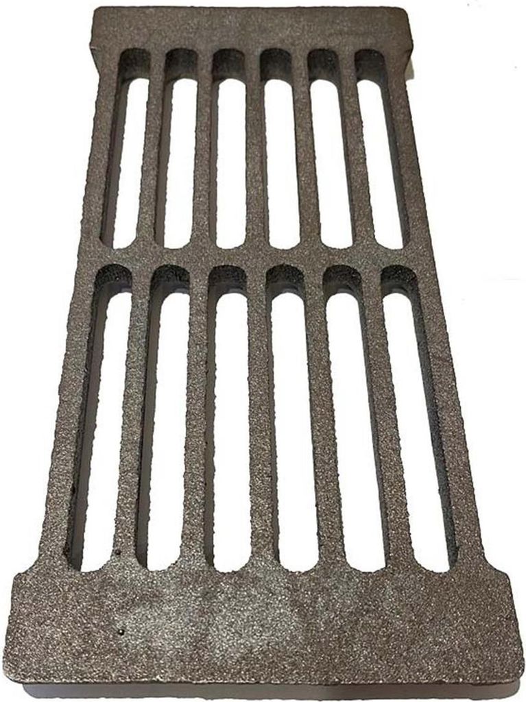 A cast iron grate on a white background.
