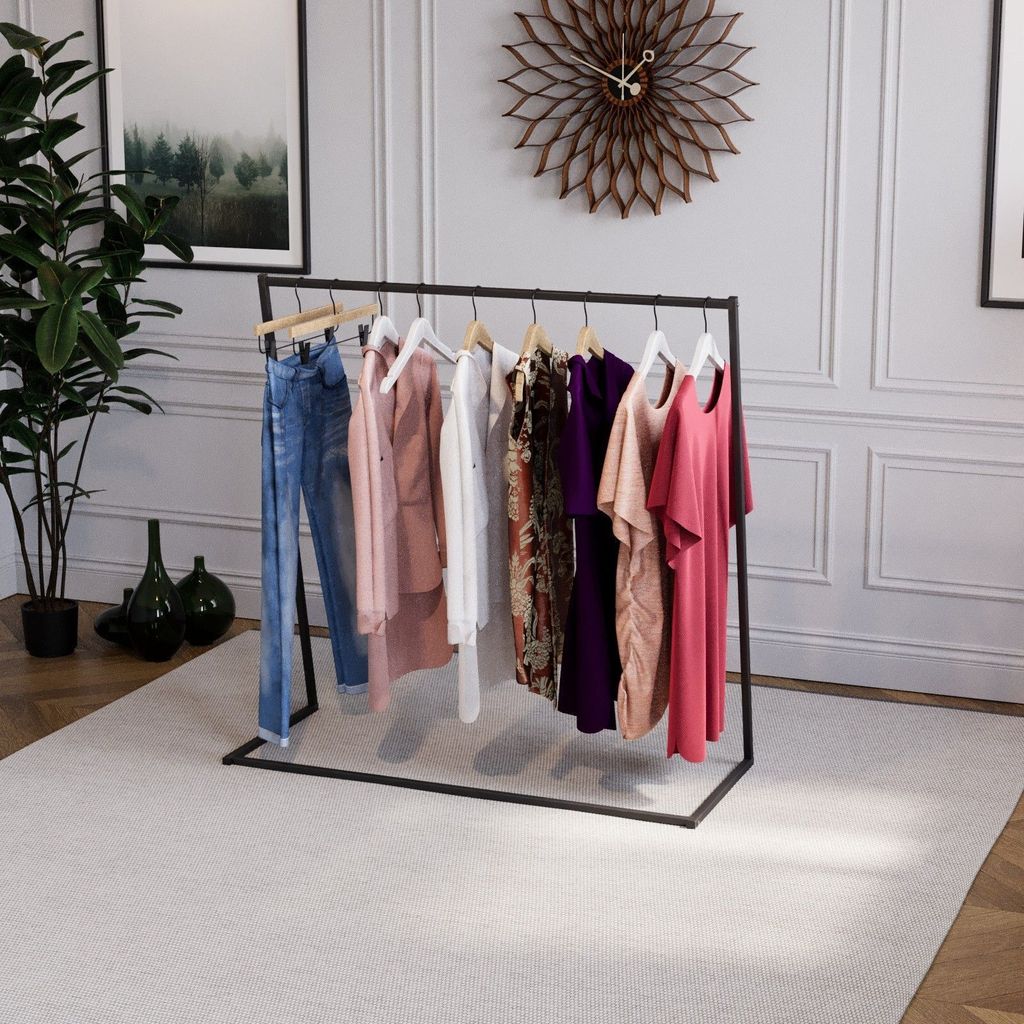 A clothing rack with various garments displayed in a room with a clock and a painting on the wall.