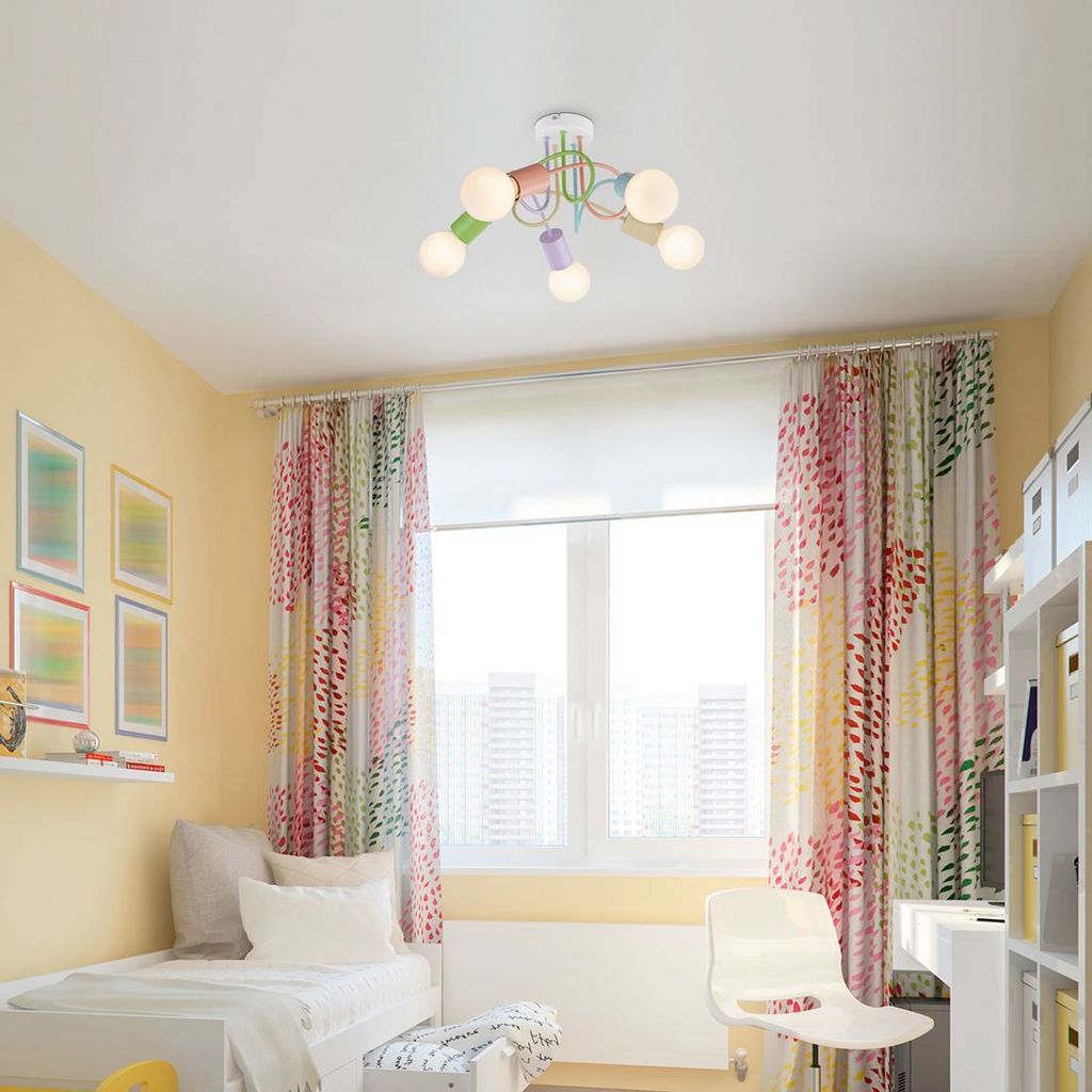 A child's bedroom with a bed, curtains, and a colorful ceiling light.
