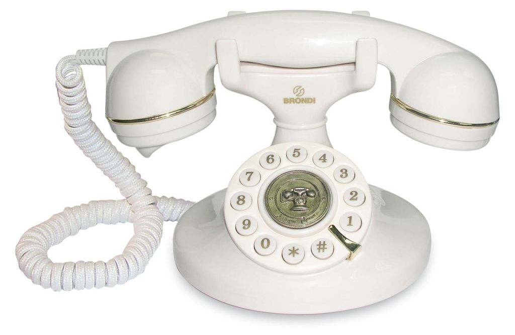A white vintage rotary dial telephone is shown against a white background.