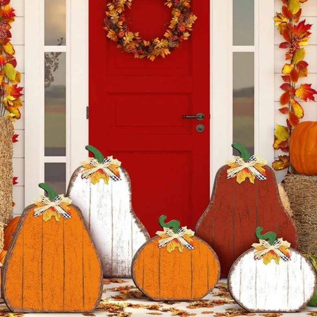 Aménager l'entrée avec 5 citrouilles en bois orange déco d'automne