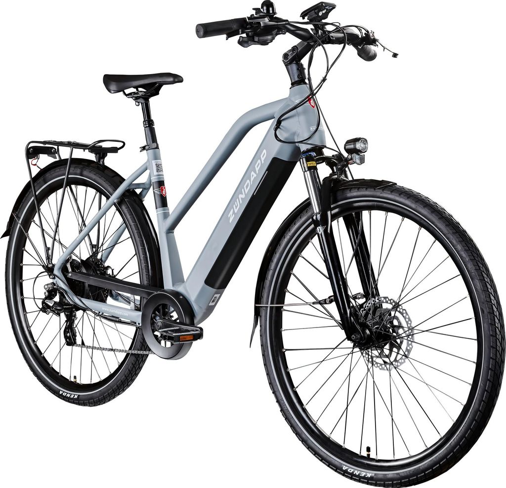 A studio shot of a gray electric bicycle against a white background.