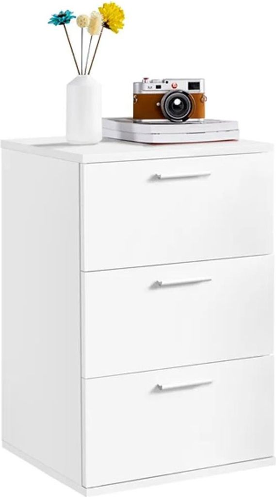 A white three-drawer filing cabinet with decorative items on top.