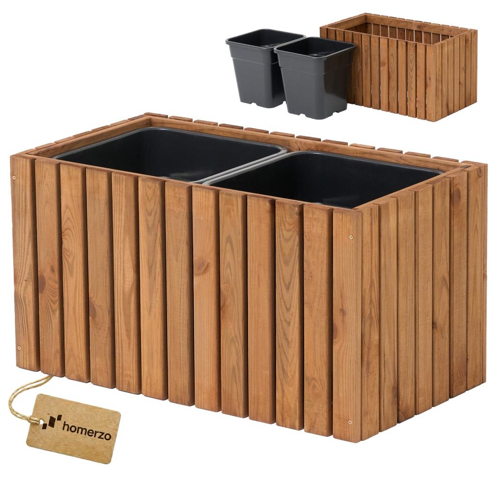A wooden planter box with two black inserts and two separate black pots shown in the background.