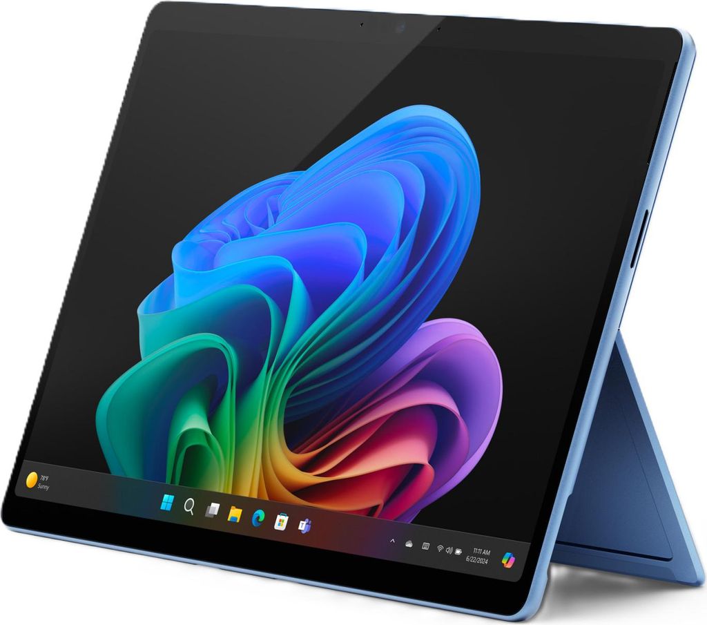 A blue Microsoft Surface Pro laptop with a colorful abstract wallpaper on its screen.