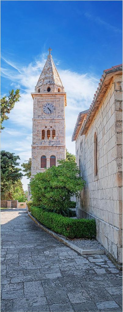 Wallario selbstklebendes Poster - Stille am Kirchturm, Größe: 50 x 125 cm