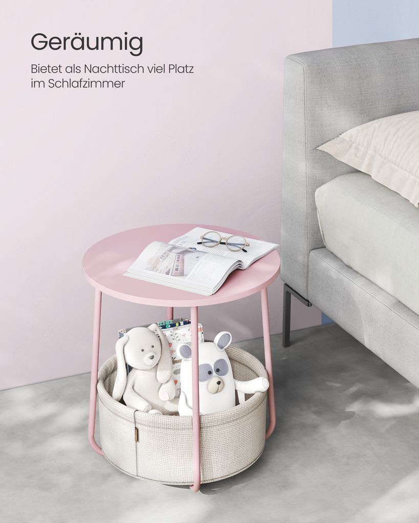 A pink side table with a storage basket containing stuffed animals, next to a bed.