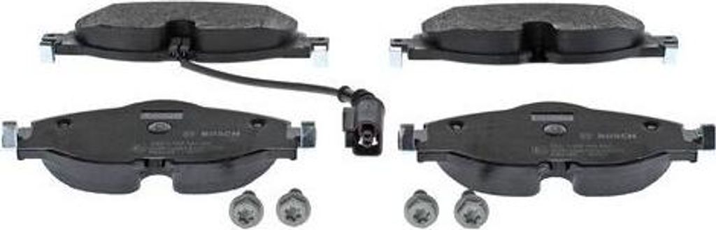Four brake pads and two screws are laid out on a white background.