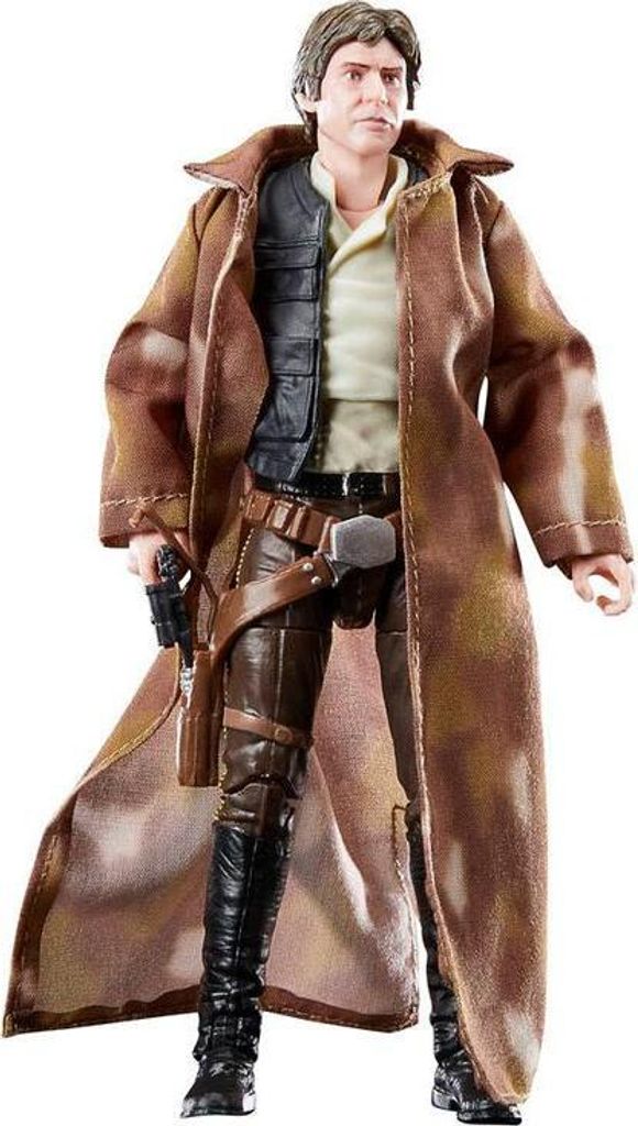 A full-body shot of a Han Solo action figure from Star Wars, wearing a long brown coat and black boots, standing against a white background.