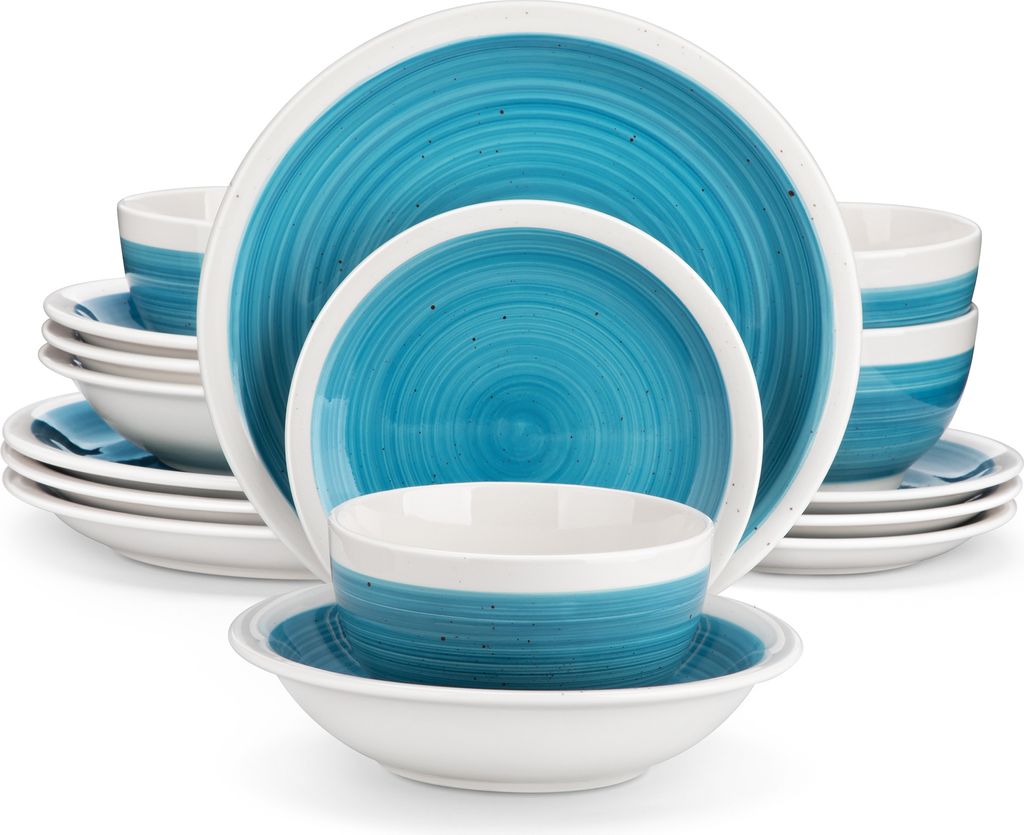 A stack of blue and white ceramic plates and bowls.