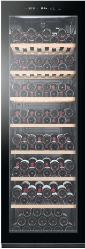 A Haier wine cellar filled with wine bottles, standing upright on wooden shelves.