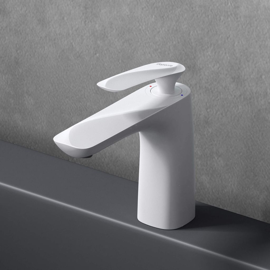 A white faucet is shown on a gray countertop against a gray textured wall.