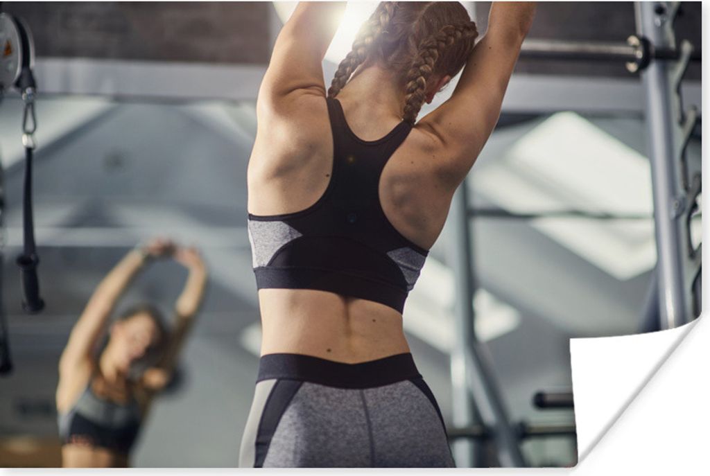 MuchoWow Poster Eine junge Frau dehnt sich bei einer Fitness-Session 60x40 cm - Schlafzimmerdekoration