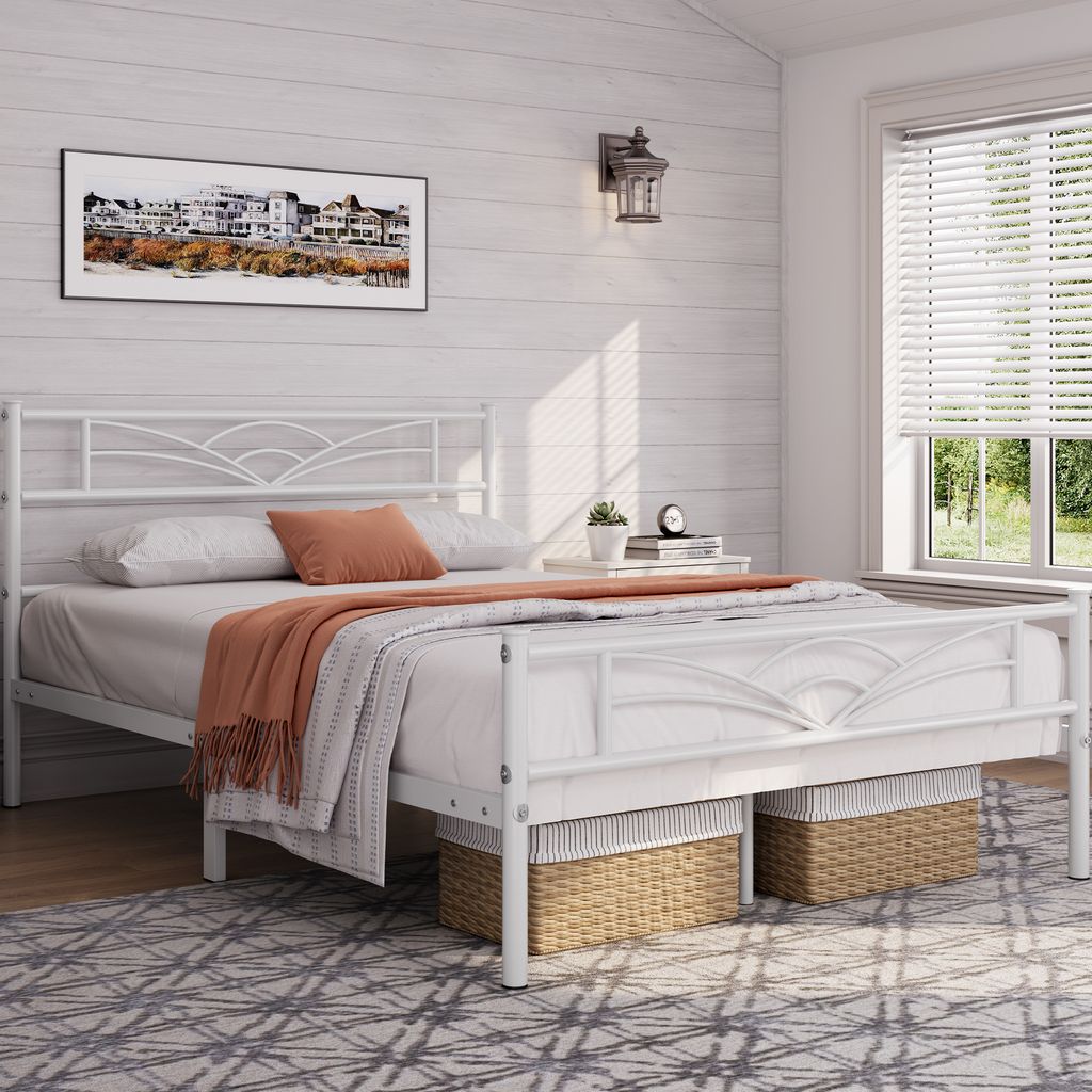 A bedroom scene with a white metal bed frame, bedding, and decorative elements.