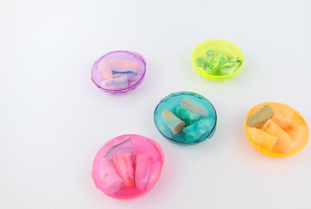 Five colorful cases of earplugs are arranged on a white background.