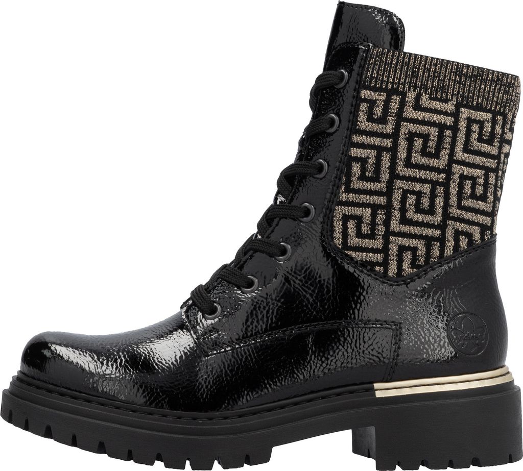 A side view of a black patent leather lace-up boot with a patterned knit cuff and a gold trim detail.