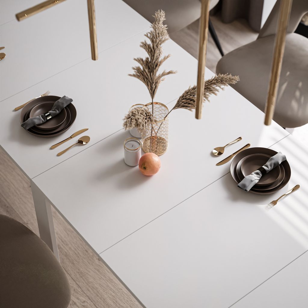 A dining table set for a meal with decorative elements.