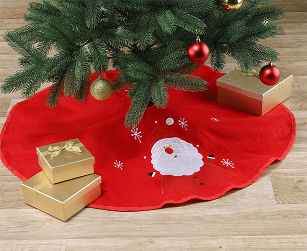 A Christmas tree skirt with Santa Claus and snowflakes, decorated with gift boxes and ornaments.