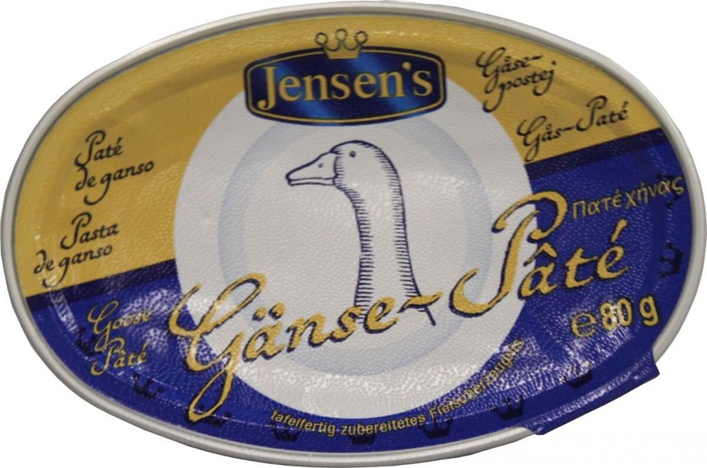 A close-up of a round metal tin of goose pâté.