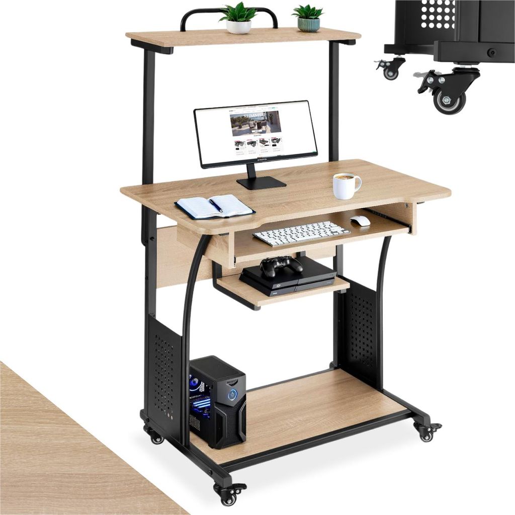 A computer desk with a monitor, keyboard, computer tower, and game console.