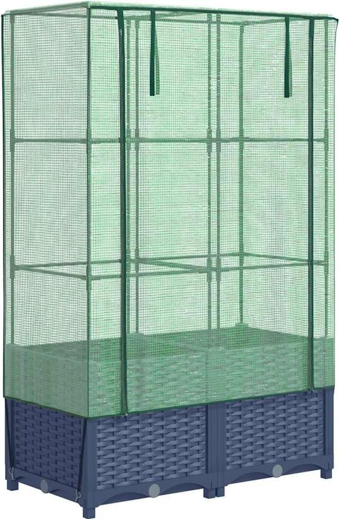 A tall, narrow greenhouse with a rattan-look base.