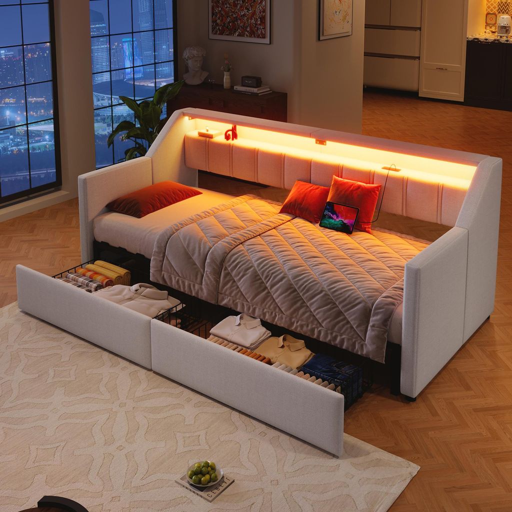 A modern daybed with integrated LED lighting and storage drawers, set in a stylish bedroom at night.