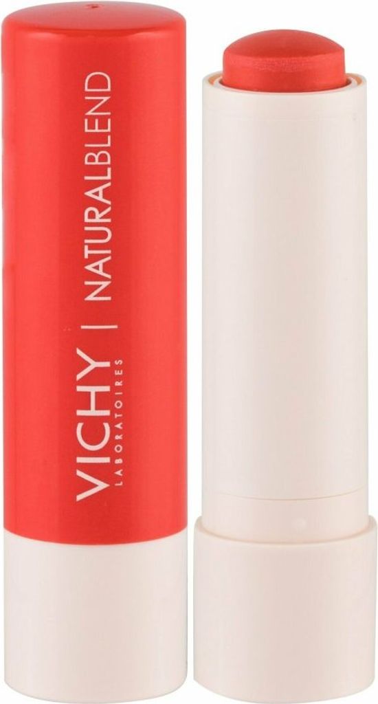 A close-up studio shot of a coral lipstick and its red casing.