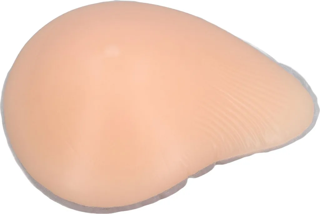 Prothèse mammaire asymétrique concave en silicone souple couleur chair
