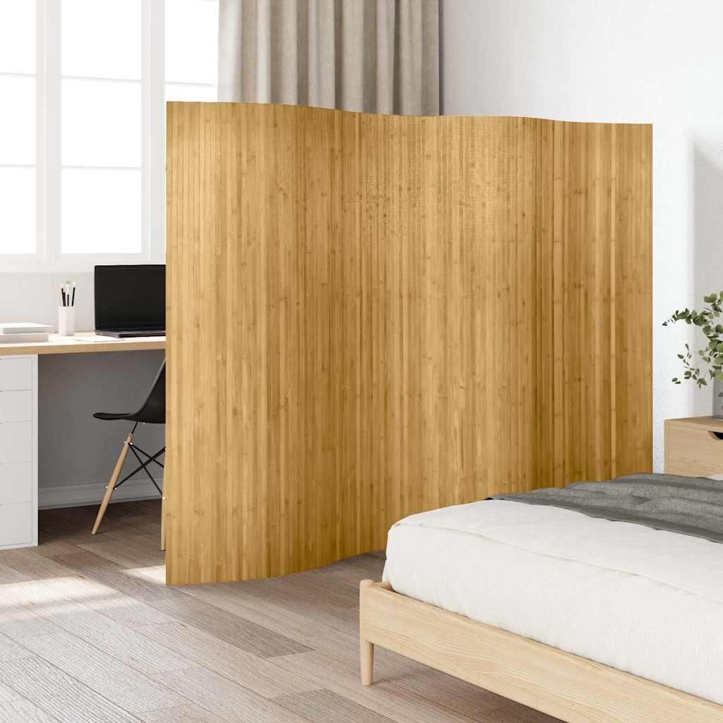 A room divider is placed between a desk area and a bed.