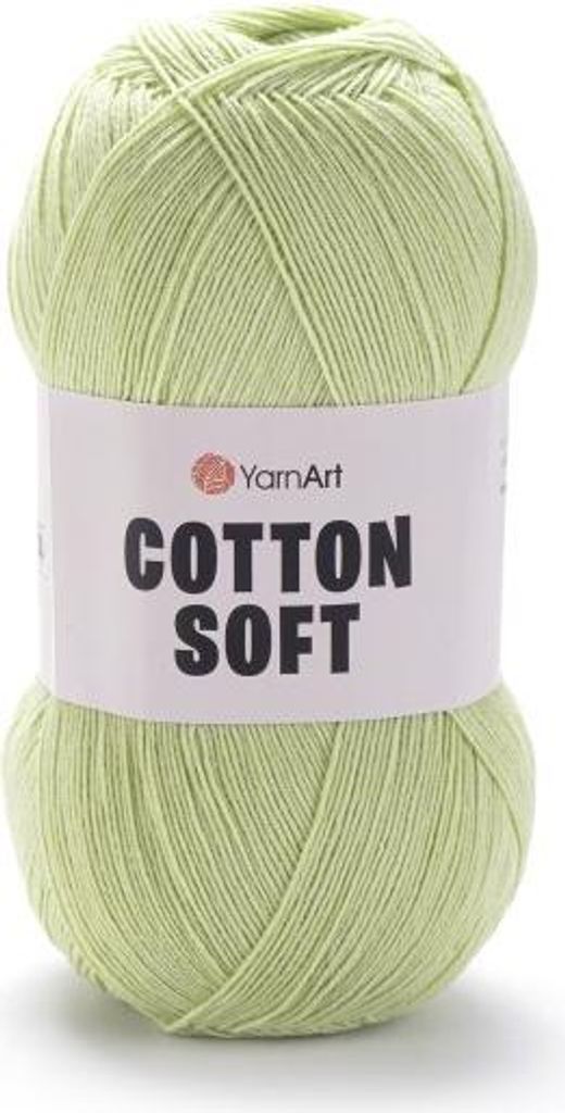 A ball of light green yarn on a white background.