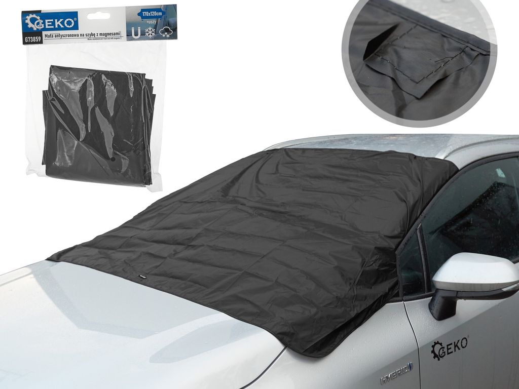 A black anti-frost mat is placed on the windshield of a car.