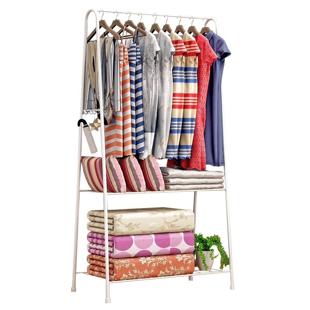 A white metal garment rack with clothes and folded bedding.