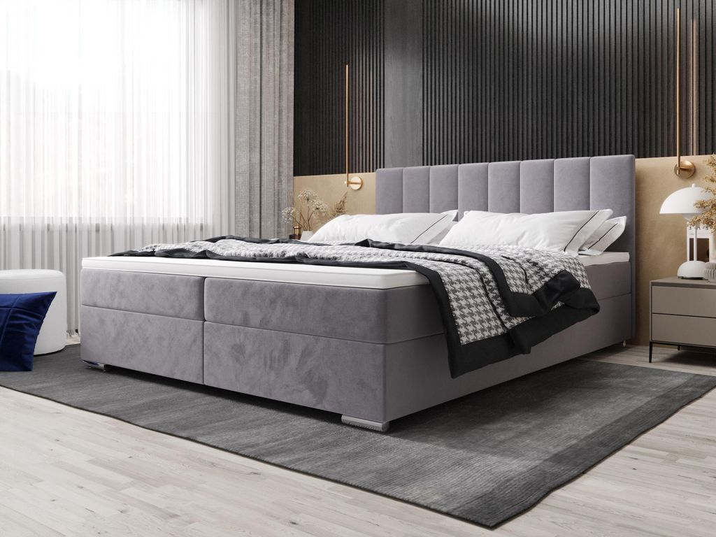A bedroom scene featuring a bed with storage.