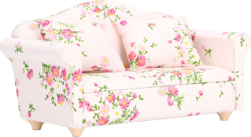 A miniature sofa with a floral pattern.