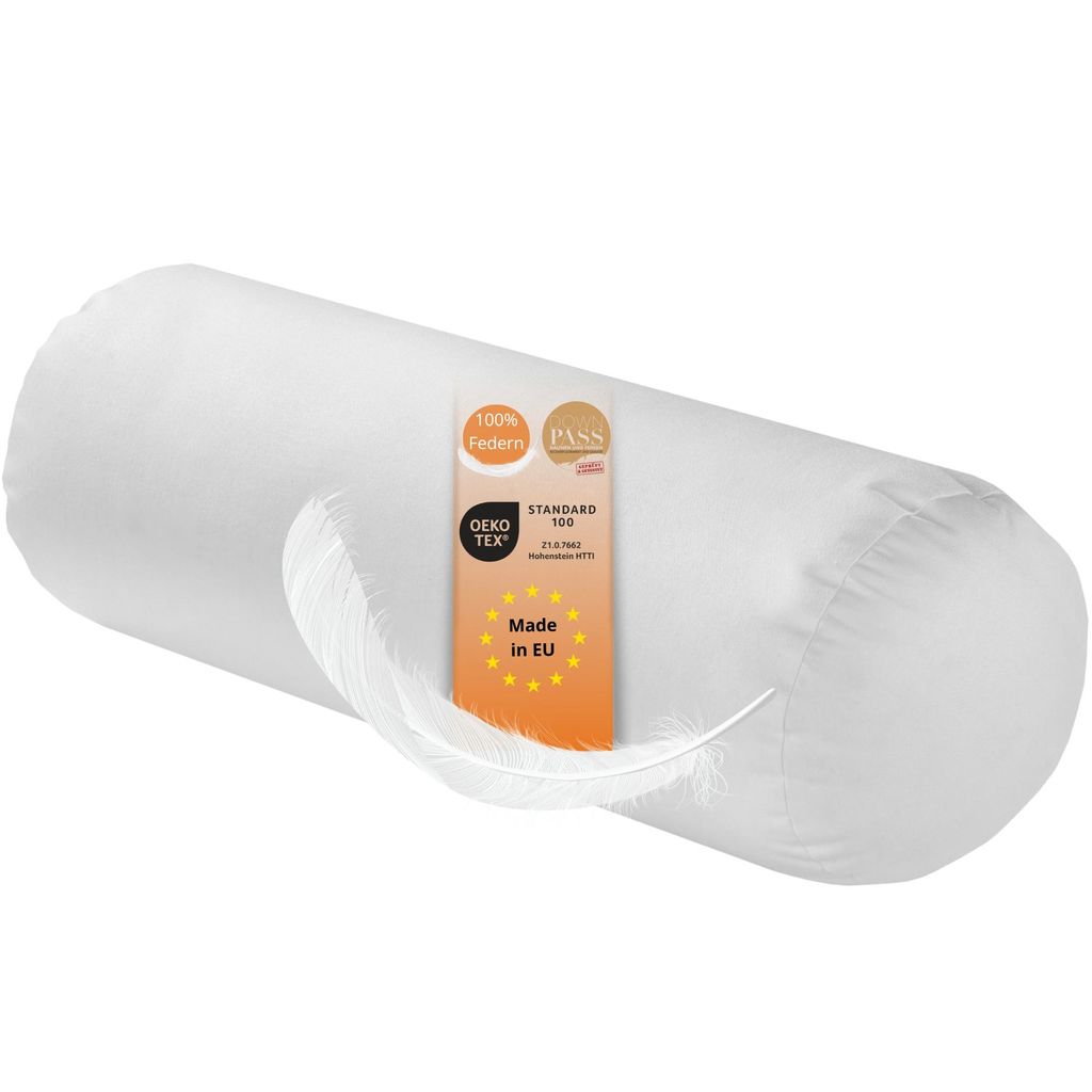 A white cylindrical pillow with a feather resting on it and a label attached.