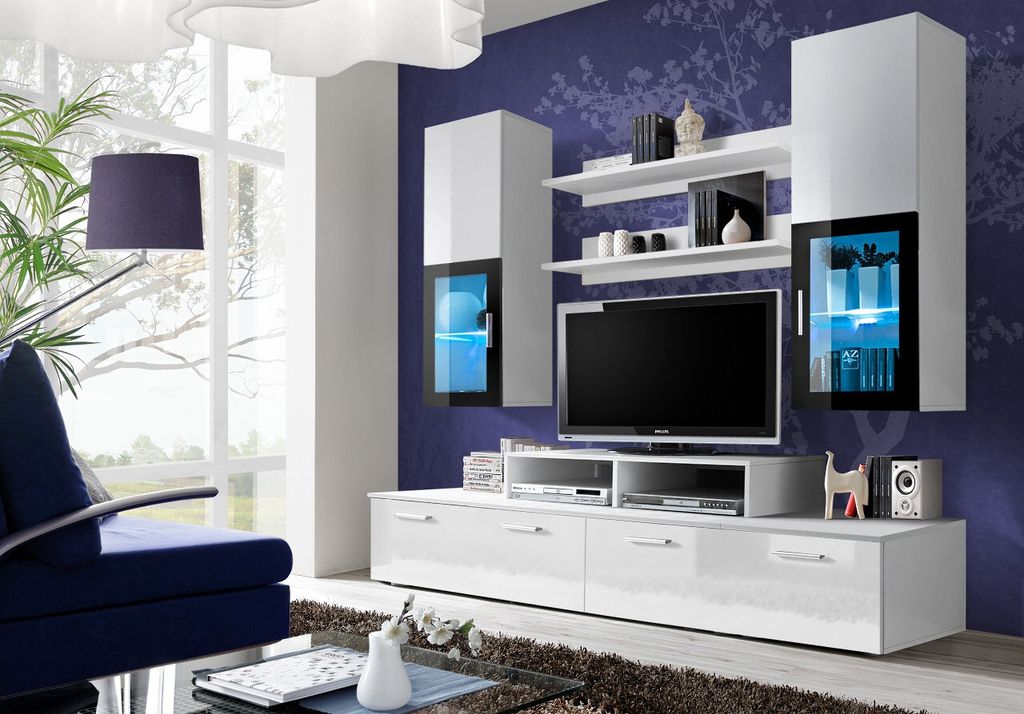 A modern living room with a wall-mounted entertainment unit.