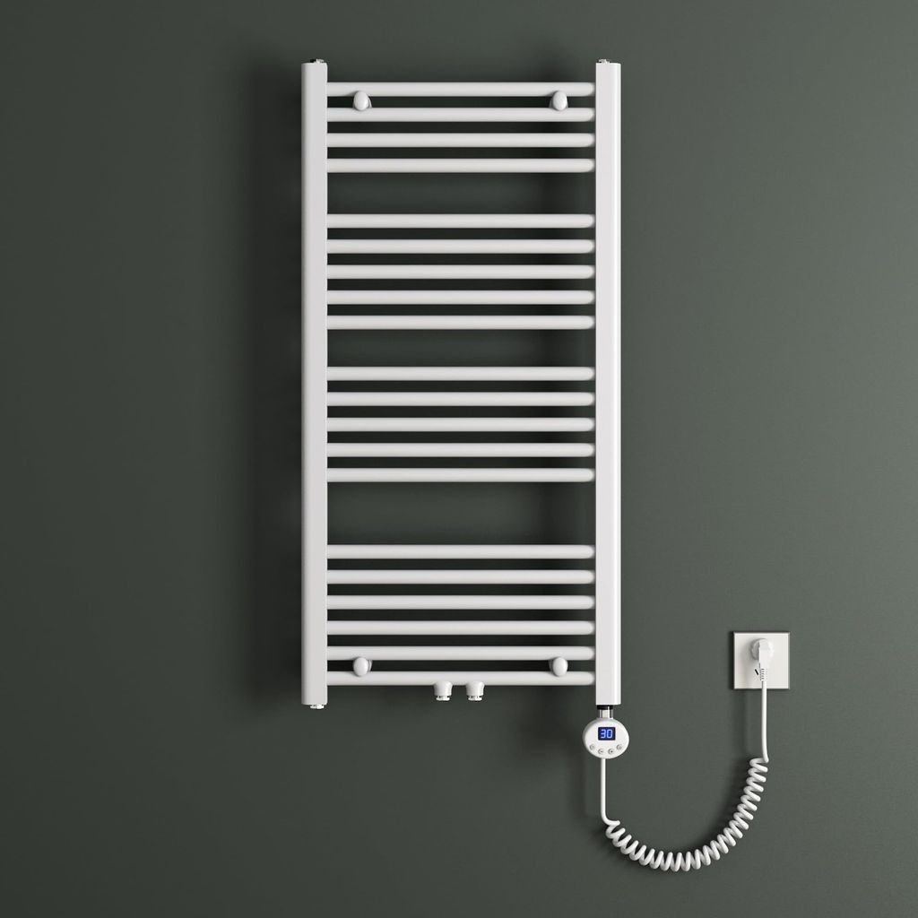 A white electric towel radiator mounted on a dark gray wall, with its coiled power cord connected to a wall socket.