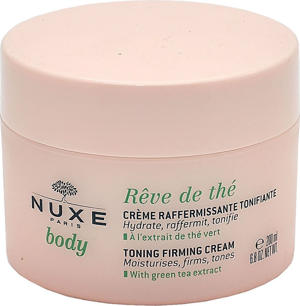A pink jar of NUXE body toning firming cream with green text.