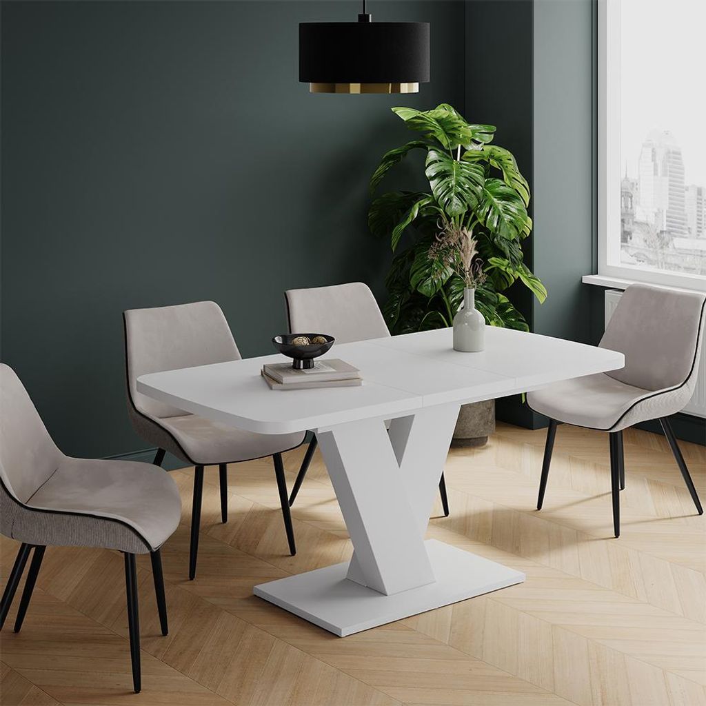 A dining table with chairs in a modern room setting.