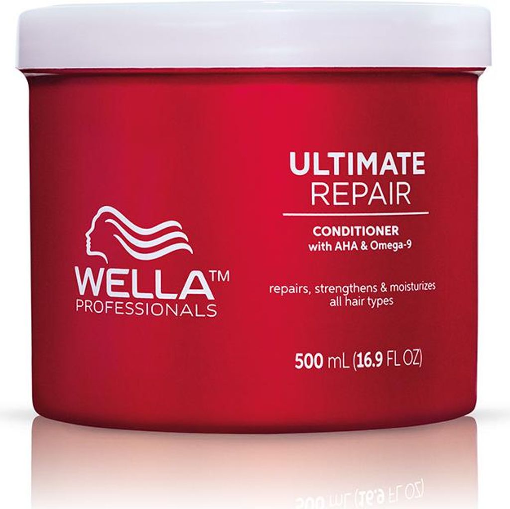 A red tub of Wella Professionals Ultimate Repair Conditioner.