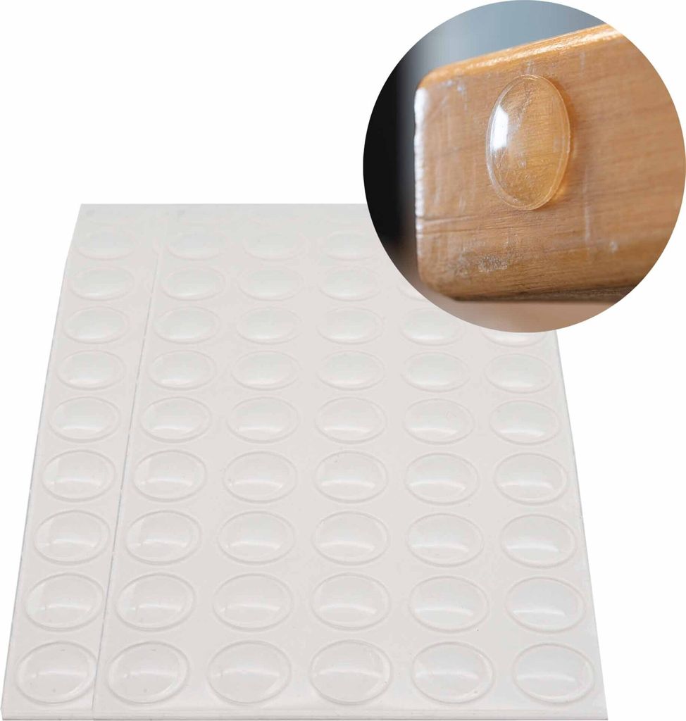 A sheet of clear adhesive bumper pads with a close-up inset showing one pad applied to the corner of a wooden surface.