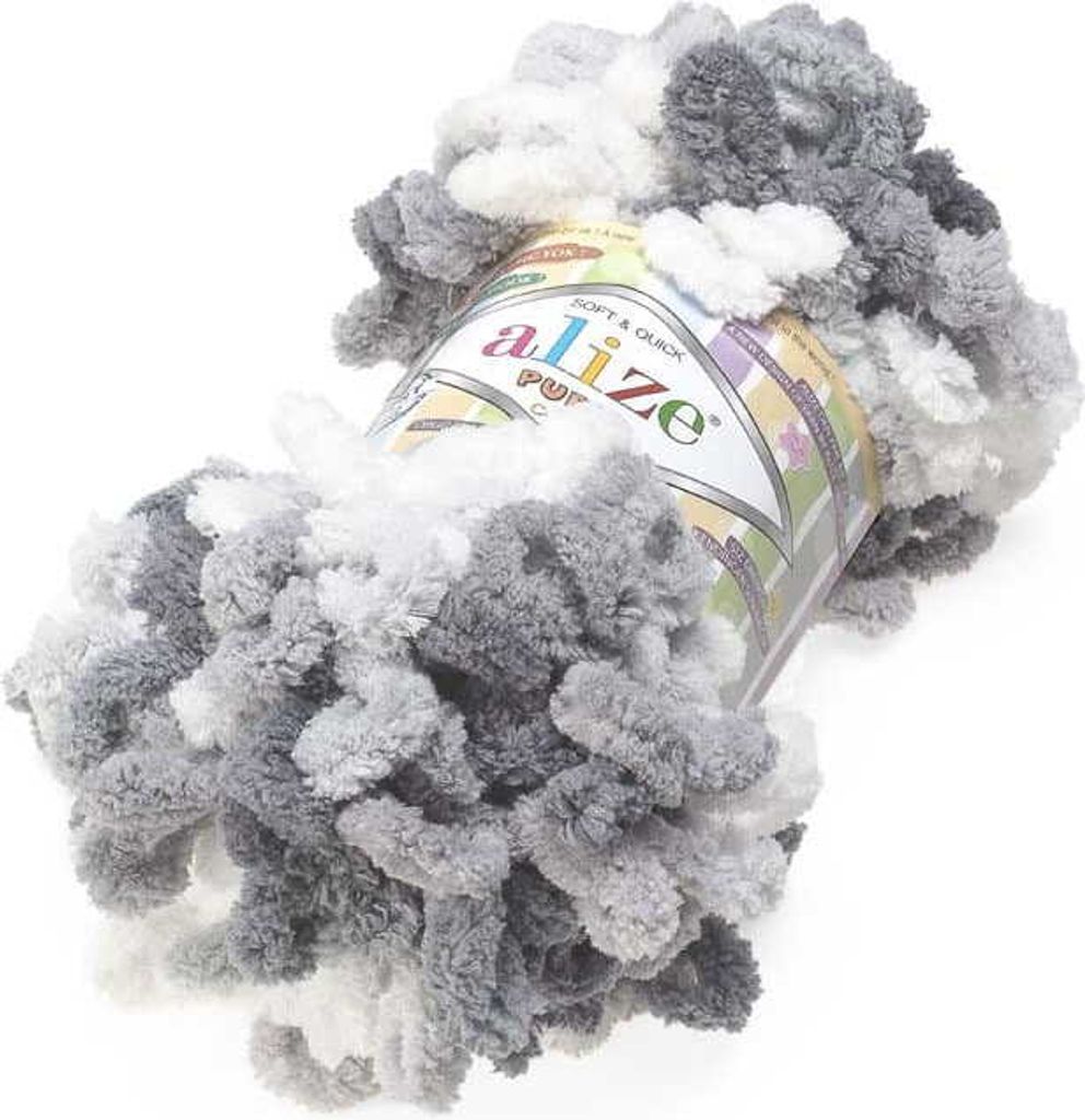 A ball of fluffy yarn in shades of gray and white.