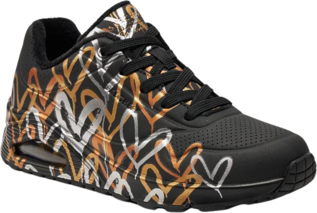 A single black sneaker with a metallic heart pattern.
